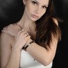 Model wearing Serpenti Expandable Bangle Diamonds and Yellow Gold Black Enamel